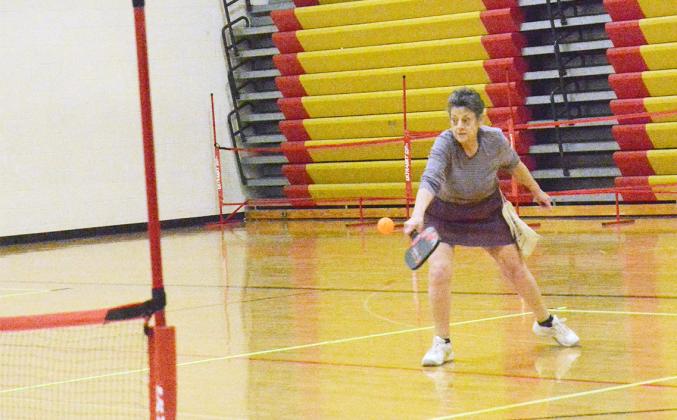 CJ EVANS returns the ball in a pickleball game at the tournament held in Tecumseh on Saturday, April 6th.