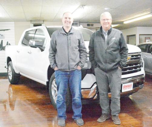 DEREK GOTTULA, left, has purchased Ken Brinkman’s stock in the Brinkman Brothers Chevrolet, GM dealership in Tecumseh.