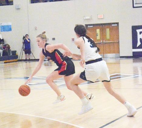 SUNNIE ROTHER (20) drives the ball inside against Freeman’s aggressive press in the opening round of subdistricts on February 13.