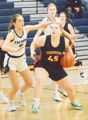 MAYA STRAKA (45) moves the ball inside under the hoop early in the Thunderbirds game with the Lady Falcons at subdistricts on February 13. Ann Wickett/Chieftain