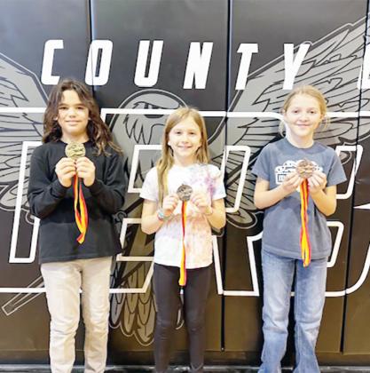JOHNSON COUNTY SPELLING BEE WINNERS IN 5TH GRADE, from the left: 1st Place, Damien Hinojosa, 2nd Place, Ada Goodrich, 3rd Place, Eleanor Burgett, all from Johnson County Central Public Schools.