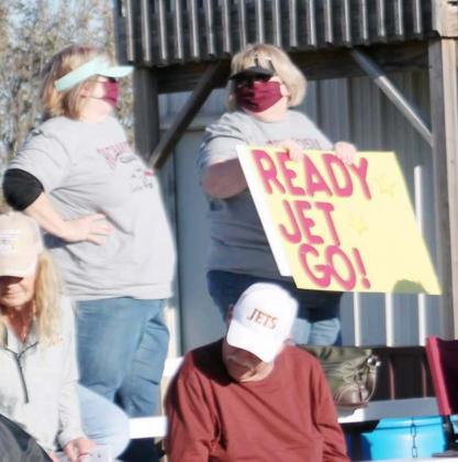 NANCY MERRITT, LEFT, AND LISA WITTROCK, right, cheer on their nephew, Andrew Richardson, and the Sterling Jets football team.