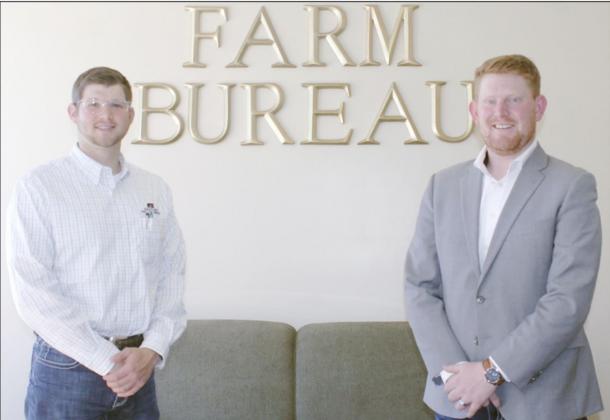 JAKE BRUSS, LEFT, AND COLTON SCHAARDT are ready to help people with their insurance needs at the Farm Bureau office in Tecumseh.
