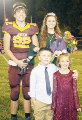 STERLING HOMECOMING King Kaleb Masur and Queen Tara Walters, stand with crownbearers Crew Heusman and Frannie Pella on the football field during halftime of the game.