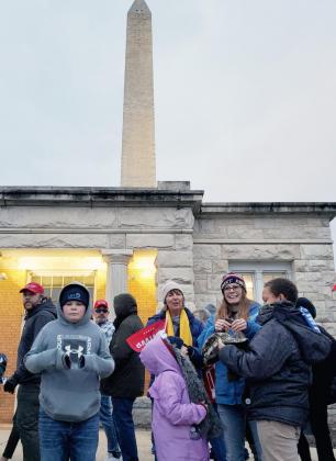 A WASHINGTON MONUMENT VISITOR’S CENTER was a good place to stop for a picture. From the left: Front - Taven Borcher, Lena and Saung; behind Lena is Marcia Borcher and next to her is Samantha Plock.