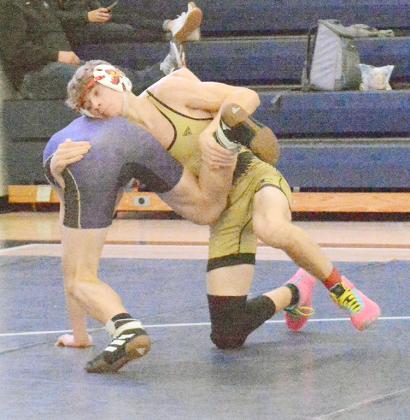 LOGAN TOPP battles for a takedown in this match against an opponent at the Freeman Invitational held on January 26.