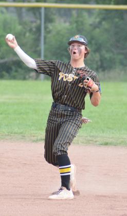 CHASE VANWINKLE throws a Falls City runner out at first base in the quarterfinal round of the conference tournament on Wednesday, June 21.