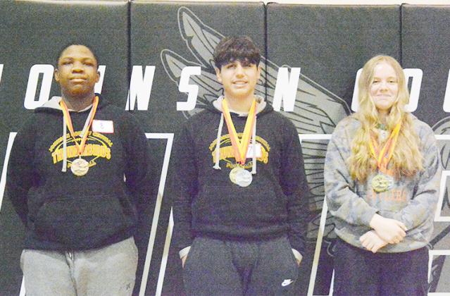 ROUND 2 SPELLING BEE WINNERS IN 8TH GRADE, from right to left: 1st place-Stefani Peters, 2nd-Jesus Hurtado, 3rd-Kenechukwu Ofoegbu, all of Johnson County Central.