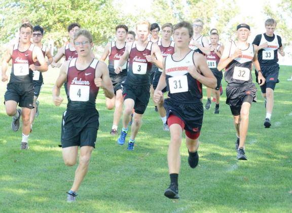 THUNDERBIRD JACOB GRAHAM (31) led out the Johnson County Central team during cross country action at the Auburn Invite. On the right behind Graham is Hayden Huskey (32) and to the right behind him is Jason Kettelhake (33).
