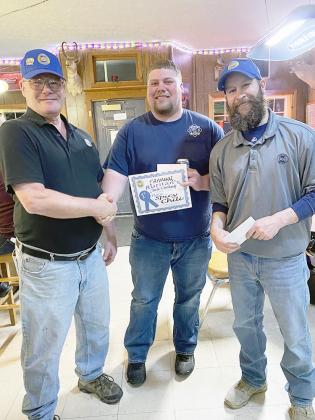 DALTON CLARK of Sterling, center, won 1st Place in the Spicy category at the Sterling Ruritans’ Chili Cooking Contest at Scott’s Place on Saturday, March 9. Presenting the award were President Richard Rambo, left, and Vice President Ben Briggs.