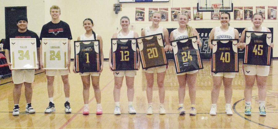 SENIORS NIGHT on February 6, also the last home game for the Johnson County Central basketball teams, was celebrated by presenting each of the seniors with their jersey in a frame, from the left: Sergio Valles, Wyatt Ludemann, Arely Cabrales, Bailee Sterup, Sunnie Rother, Ava Klein, Nathaly Martinez, and Maya Straka.