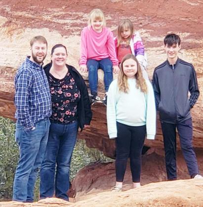 MICHAEL AND KATTIE BOHLING, left, and their children, from the right: front, Alexander and McKenzie; back, Emily and Abigail.