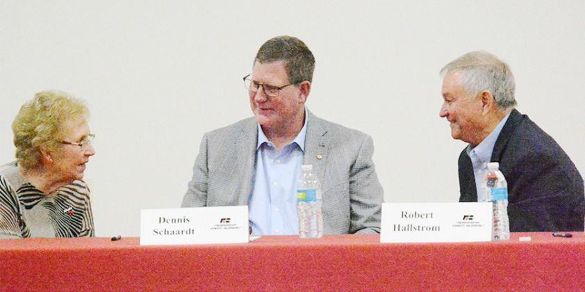 THE THREE CANDIDATES for the District 1 State Legislative seat, from the left: Glenda Willnerd, Dennis Schaardt, and Robert Hallstrom, had a friendly conversation at the Candidate Forum in Sterling Thursday night, sponsored by the Nebraska Farm Bureau.