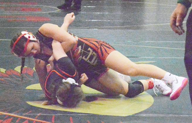 HAYLEE TREW gets ready to pin her opponent at the ECNC Conference Wrestling Invitational at Cook on January 23.