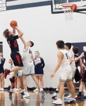 JCC’s TREY HOLTHUS (3) goes up for this shot against an aggressive HTRS Titans squad in action played on the road January 21.