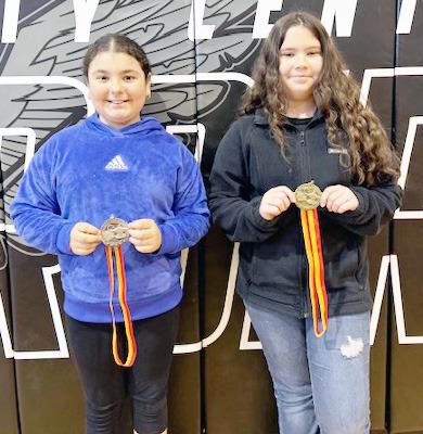 JOHNSON COUNTY SPELLING BEE WINNERS IN 4TH GRADE, from the left: 1st Place, Selena Cabrales, 2nd Place, Nathaly Hurtado-Arellano, both from Johnson County Central Public Schools, 3rd Place, Melody Dill (not pictured) from Sterling Public School.