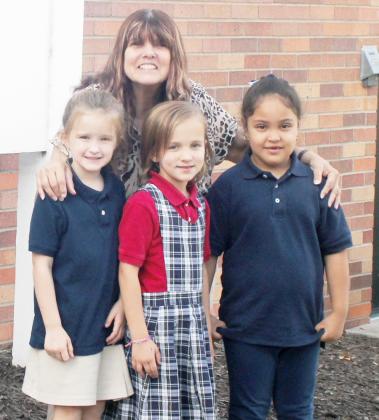 ST. ANDREW’S KINDERGARTEN STUDENTS for the 2022-2023 school year include, left to right: Gertrude Sisco, Zelie Stutheit and Alma Rodas Pinedo. Their teacher is Denise Farr (in back).