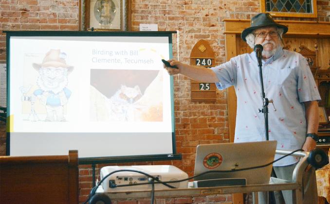 BILL CLEMENTE of Auburn opens his program on bird watching for Monday Night at the Museum in Tecumseh on July 17.